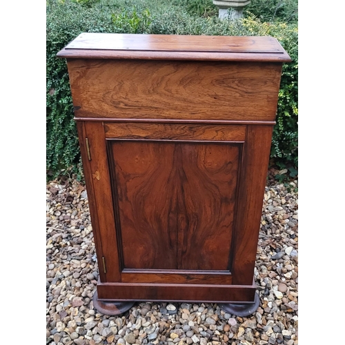 331 - A VICTORIAN ROSEWOOD DAVENPORT DESK
With leather surface, enclosing a fitted interior, with cupboard... 