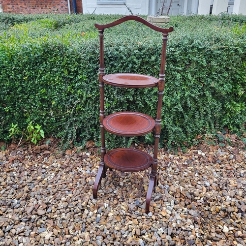 332 - AN EDWARDIAN MAHOGANY FOLDING THREE TIER CAKE STAND
Along with a Victorian mahogany occasional table... 