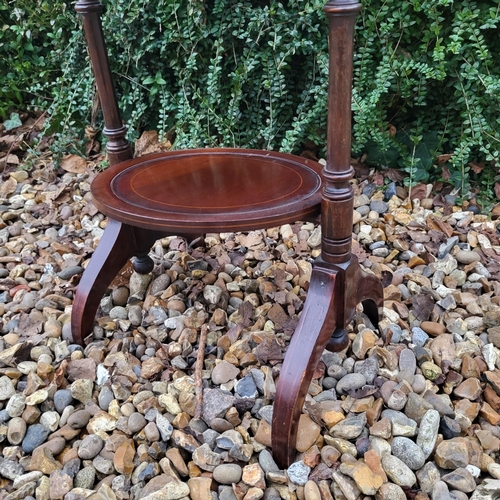 332 - AN EDWARDIAN MAHOGANY FOLDING THREE TIER CAKE STAND
Along with a Victorian mahogany occasional table... 