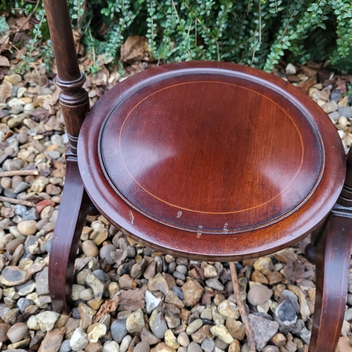 332 - AN EDWARDIAN MAHOGANY FOLDING THREE TIER CAKE STAND
Along with a Victorian mahogany occasional table... 