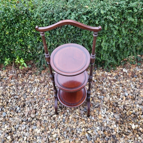 332 - AN EDWARDIAN MAHOGANY FOLDING THREE TIER CAKE STAND
Along with a Victorian mahogany occasional table... 