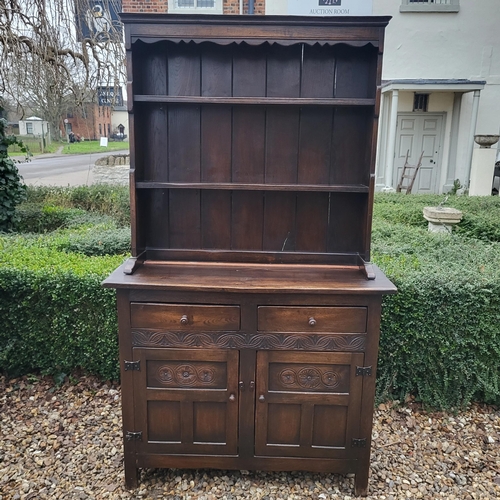 333 - A 17TH CENTURY STYLE OAK DRESSER
With open shelves above two drawers and cupboards.
(w 106cm x d 39c... 