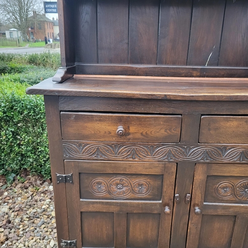 333 - A 17TH CENTURY STYLE OAK DRESSER
With open shelves above two drawers and cupboards.
(w 106cm x d 39c... 