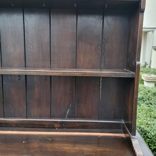 333 - A 17TH CENTURY STYLE OAK DRESSER
With open shelves above two drawers and cupboards.
(w 106cm x d 39c... 