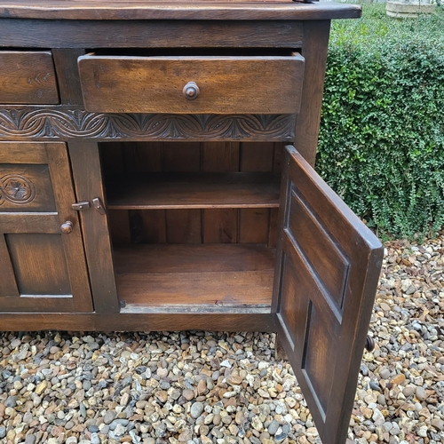 333 - A 17TH CENTURY STYLE OAK DRESSER
With open shelves above two drawers and cupboards.
(w 106cm x d 39c... 