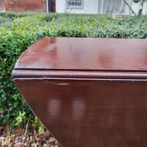 334 - A 19TH CENTURY SOLID MAHOGANY CIRCULAR DROP LEAF TABLE
On turned legs with pad feet.
(110cm x d 35cm... 