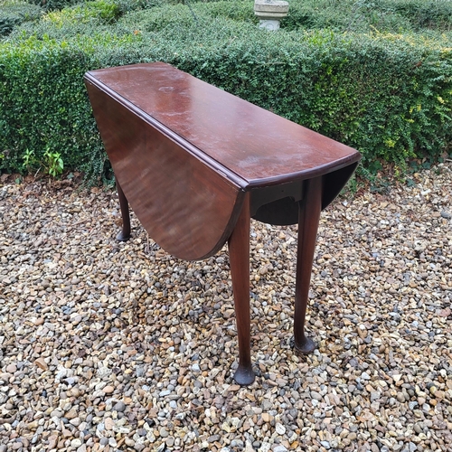 334 - A 19TH CENTURY SOLID MAHOGANY CIRCULAR DROP LEAF TABLE
On turned legs with pad feet.
(110cm x d 35cm... 