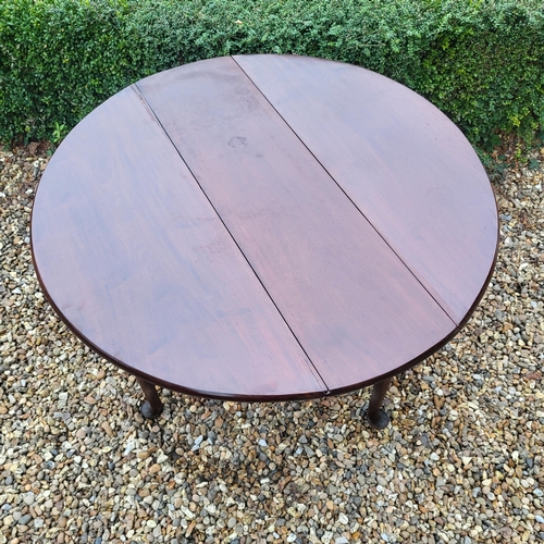 334 - A 19TH CENTURY SOLID MAHOGANY CIRCULAR DROP LEAF TABLE
On turned legs with pad feet.
(110cm x d 35cm... 