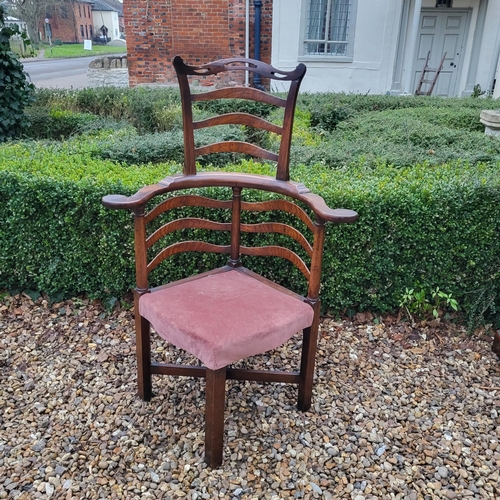 335 - A 19TH CENTURY ELM LADDER BACK CORNER CHAIR
With pierced serpentine top rail, overstuffed upholstere... 