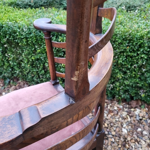 335 - A 19TH CENTURY ELM LADDER BACK CORNER CHAIR
With pierced serpentine top rail, overstuffed upholstere... 