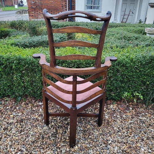 335 - A 19TH CENTURY ELM LADDER BACK CORNER CHAIR
With pierced serpentine top rail, overstuffed upholstere... 