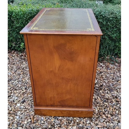 336 - A 19TH CENTURY MAHOGANY AND SATINWOOD KNEEHOLE DESK
With tooled leather writing surface above an arr... 