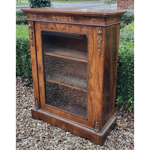 339 - A HIGH VICTORIAN FIGURED WALNUT AND MARQUETRY INLAID PIER CABINET
The single glazed door enclosing a... 