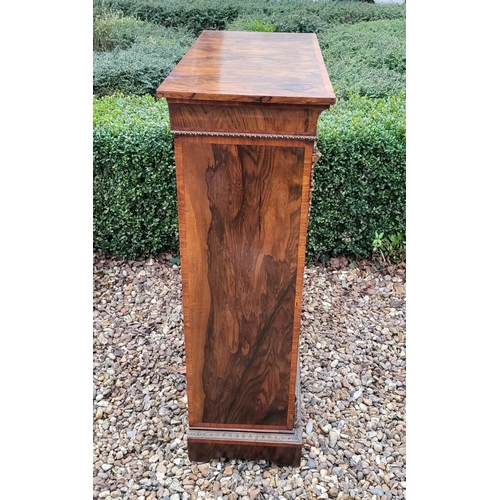 339 - A HIGH VICTORIAN FIGURED WALNUT AND MARQUETRY INLAID PIER CABINET
The single glazed door enclosing a... 