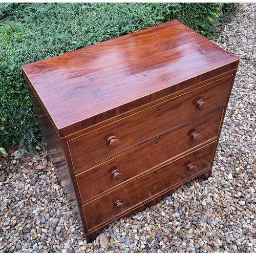 340 - A VICTORIAN MAHOGANY CHEST OF THREE LONG DRAWERS
Fitted with knob handles, on shaped apron on bracke... 