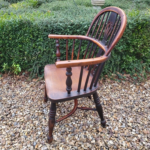 344 - A 19TH CENTURY YEW AND ELM WINDSOR CHAIR
With pierced splat back, elm seat and crinoline stretcher, ... 