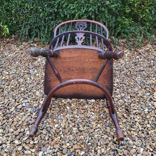 344 - A 19TH CENTURY YEW AND ELM WINDSOR CHAIR
With pierced splat back, elm seat and crinoline stretcher, ... 