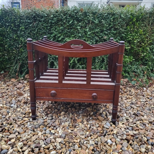 348 - A VICTORIAN MAHOGANY FOUR SECTION CANTERBURY
With single drawer, on ring turned legs, along with a m... 