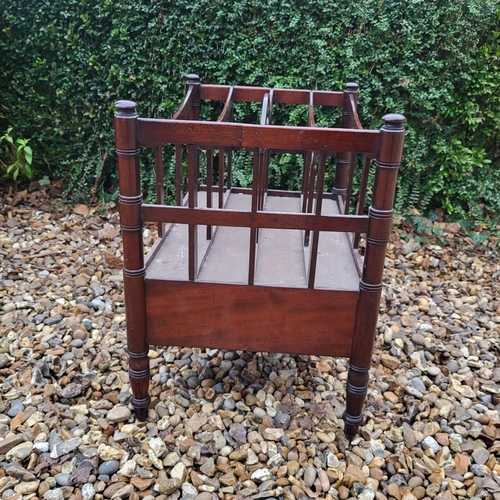 348 - A VICTORIAN MAHOGANY FOUR SECTION CANTERBURY
With single drawer, on ring turned legs, along with a m... 