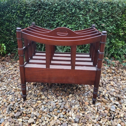 348 - A VICTORIAN MAHOGANY FOUR SECTION CANTERBURY
With single drawer, on ring turned legs, along with a m... 