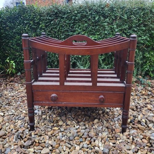 348 - A VICTORIAN MAHOGANY FOUR SECTION CANTERBURY
With single drawer, on ring turned legs, along with a m... 