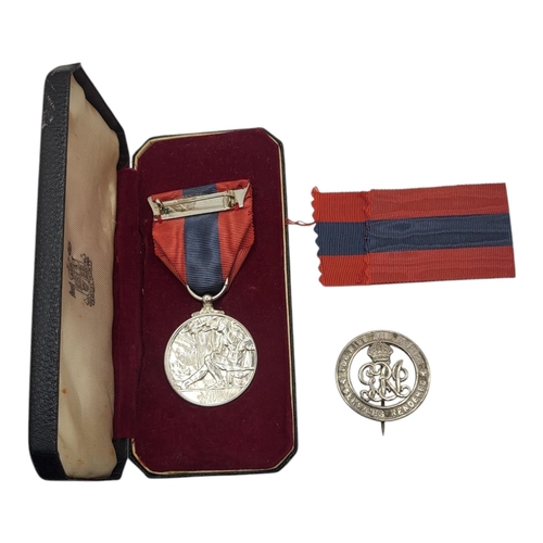 56 - A QUEEN ELIZABETH II SILVER IMPERIAL SERVICE MEDAL AND WWI SILVER WAR BADGE
Issued to George Raymond... 