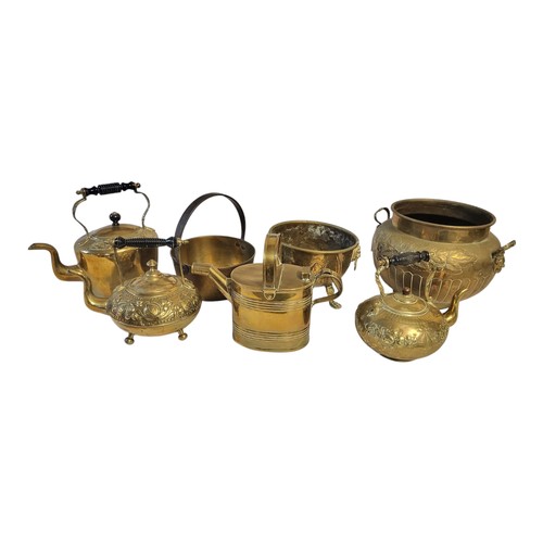 127 - A COLLECTION OF THREE VICTORIAN BRASS TEA KETTLES
Having turned wooden handles and embossed decorati... 