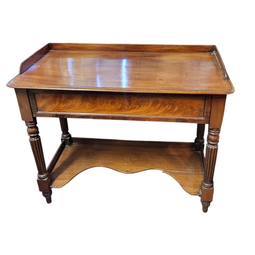 359 - A VICTORIAN MAHOGANY SIDE TABLE
Having a gallery rail ,single drawer with reeded legs and a shaped s... 