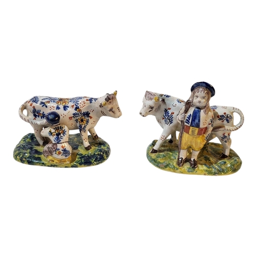 190 - A 19TH CENTURY DUTCH DELFT FIGURAL GROUP OF A YOUNG SHEPHERD AND HIS HORNED COW
Polychrome painted w... 