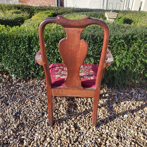 369 - AN 18TH CENTURY OAK OPEN ARMCHAIR
With vase splat back, scroll arms, tapestry upholstered seat deep ... 