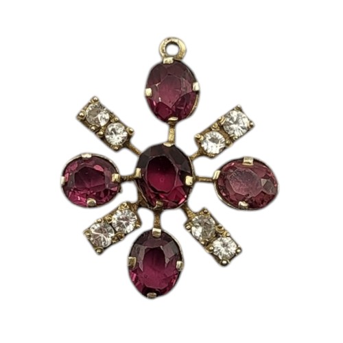 93 - A VINTAGE YELLOW METAL AMETHYST AND DIAMOND PENDANT
Having an arrangement of oval cut amethysts inte... 