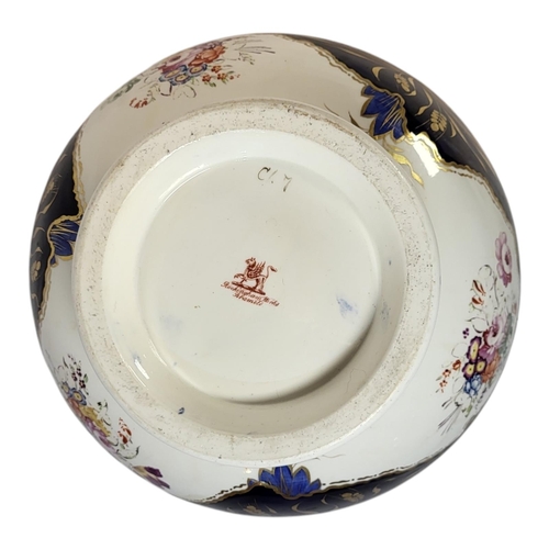 106 - ROCKINGHAM, A LARGE 19TH CENTURY PORCELAIN PEDESTAL BOWL
Hand painted decoration with blue border an... 