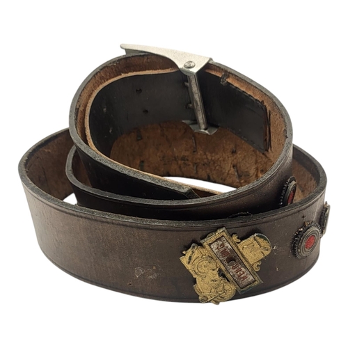 110 - A WWII GERMAN MILITARY LEATHER BELT
Having a swastika to buckle and military regalia set into leathe... 