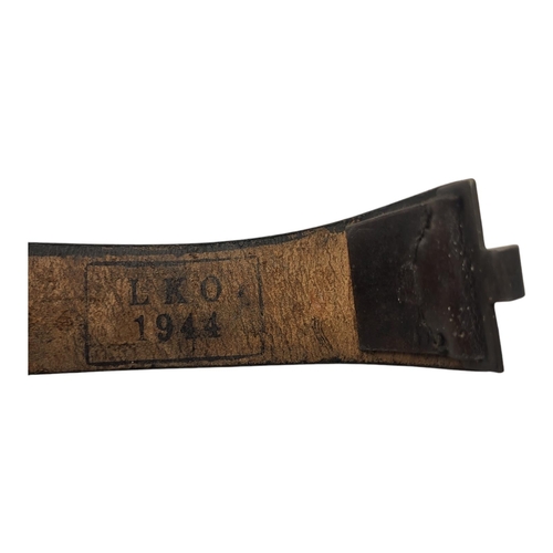 110 - A WWII GERMAN MILITARY LEATHER BELT
Having a swastika to buckle and military regalia set into leathe... 