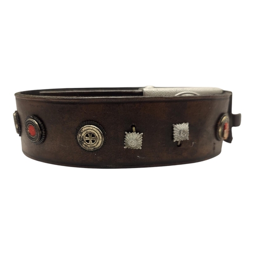 110 - A WWII GERMAN MILITARY LEATHER BELT
Having a swastika to buckle and military regalia set into leathe... 