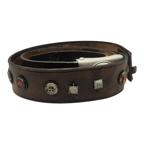 110 - A WWII GERMAN MILITARY LEATHER BELT
Having a swastika to buckle and military regalia set into leathe... 