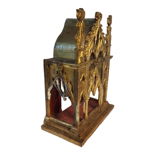 122 - AN EARLY 19TH CENTURY GOTHIC REVIVAL GILDED CARVED LIMEWOOD CHAPEL TABERNACLE 
House of consecrated ... 