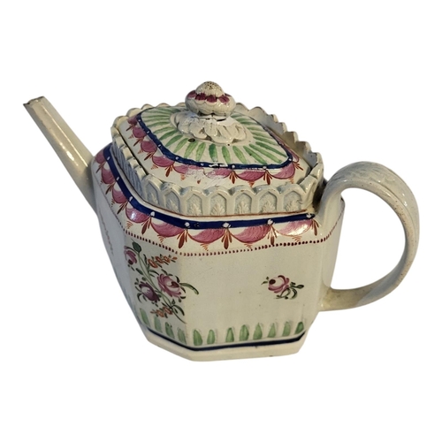 152 - AN 18TH CENTURY ENGLISH CREAMWARE TEAPOT AND COVER, CIRCA 1780 - 1800
Swirl flute lozenge form pink ... 