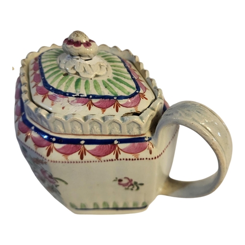 152 - AN 18TH CENTURY ENGLISH CREAMWARE TEAPOT AND COVER, CIRCA 1780 - 1800
Swirl flute lozenge form pink ... 