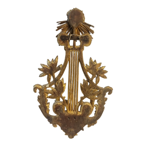 177 - A GILT BRONZE TWO BRANCH WALL SCONCE
With facial mask above lyre and foliage.
(w 37cm x h 60cm)

Con... 