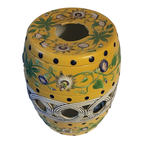 184 - A 20TH CENTURY CHINESE POTTERY GARDEN SEAT
Yellow ground with pierced and embossed decoration.
(appr... 