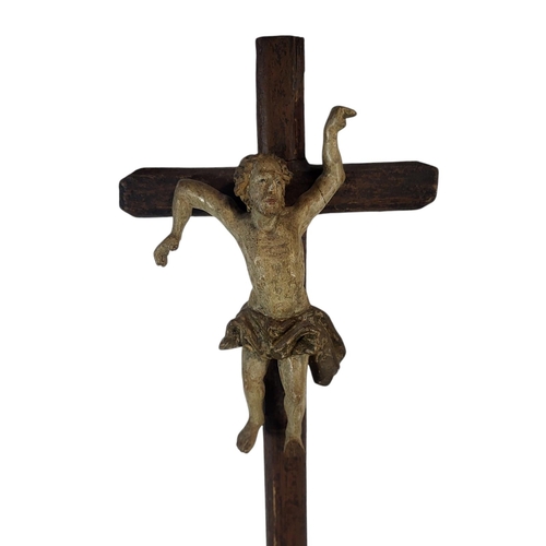 188 - A 19TH CENTURY CARVED WOOD AND POLYCHROME GROUP CRUCIFIXION SCENE
Central figure of Christ flanked b... 