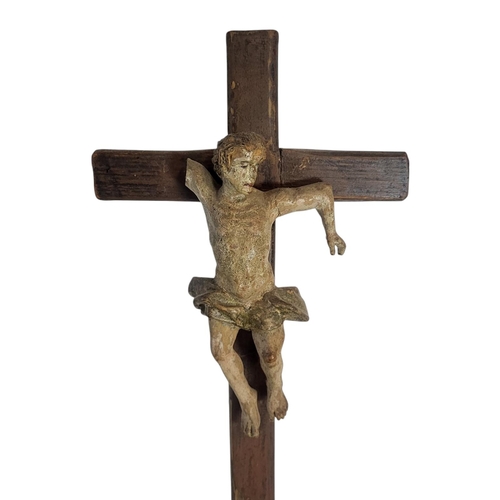 188 - A 19TH CENTURY CARVED WOOD AND POLYCHROME GROUP CRUCIFIXION SCENE
Central figure of Christ flanked b... 