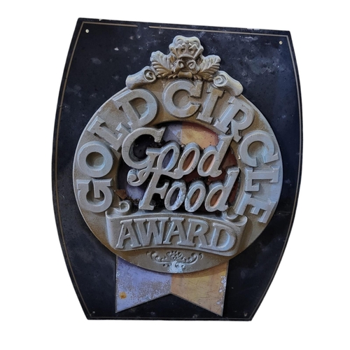 190 - A PAIR OF VINTAGE CAST METAL ‘GOLD CIRCLE GOOD FOOD AWARD’ WALL PLAQUES
Cast in relief on ebonised b... 