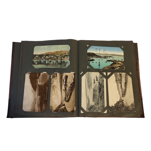 195 - TWO EDWARDIAN POSTCARD ALBUMS
An album containing topographical views of Oxfordshire to include Chin... 