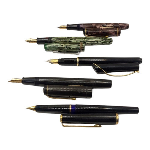 23 - A COLLECTION OF VINTAGE FOUNTAIN PENS
To include two marbled pens with 14ct gold nibs, Burnham 49 an... 