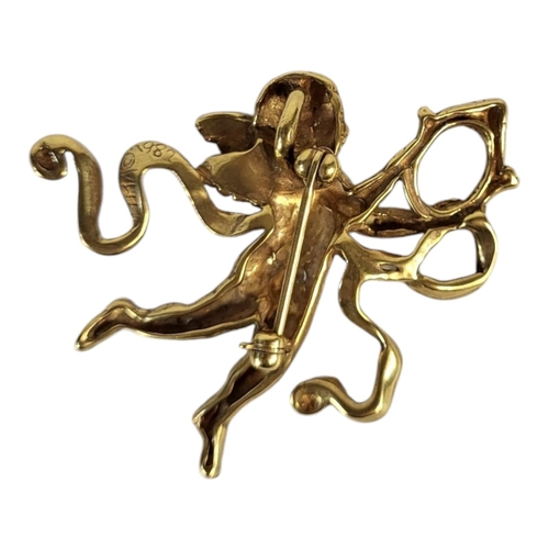 31 - A VINTAGE YELLOW METAL CHERUB BROOCH
Pierced design with a winged figure, marked ‘MMA 1982’.
(approx... 