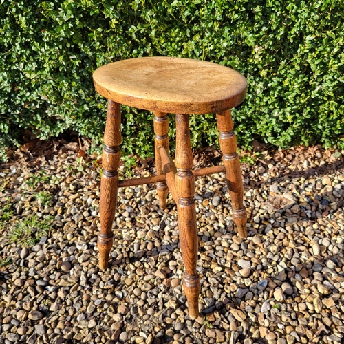 352 - A LATE VICTORIAN OAK MILKING STOOL
Along with an Elizabethan style oak stool with woven leather seat... 