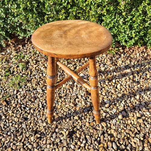 352 - A LATE VICTORIAN OAK MILKING STOOL
Along with an Elizabethan style oak stool with woven leather seat... 