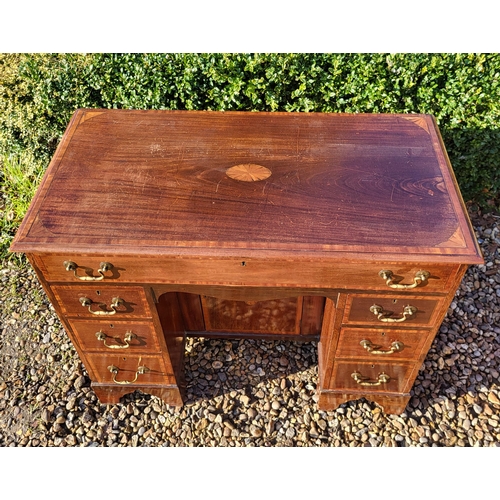 353 - A LATE VICTORIAN MAHOGANY AND SHELL INLAID SHERATON INSPIRED KNEEHOLE DESK
With an arrangement of se... 